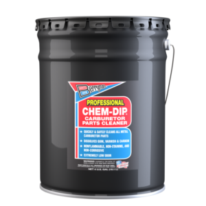 A large black barrel of Chem-Dip paint stripper with a red and blue label.
